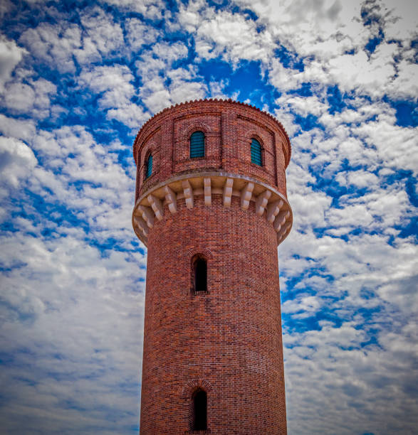 istock high tower on cloudy sky background, Italy 1024911460