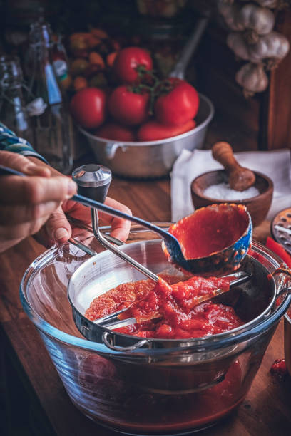 istock Preparing Homemade Tomato Sauce and Preserving in Bottles 1024919556