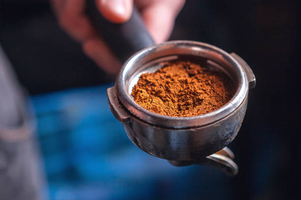 istock Barista holding portafilter for espresso coffee machine. 1024929342