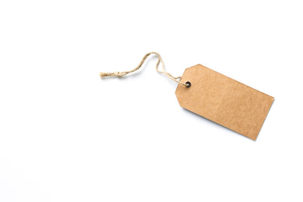 istock Blank brown cardboard price tag or label with thread isolated white background. 1024940230