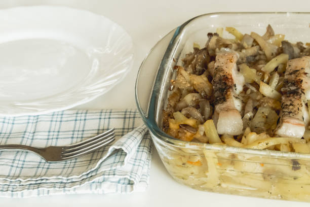 istock Casserole with potatoes, melted cheese, with fish pieces 1024947538