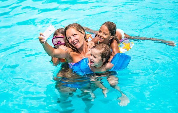 istock Family selfie in the pool 1024947840