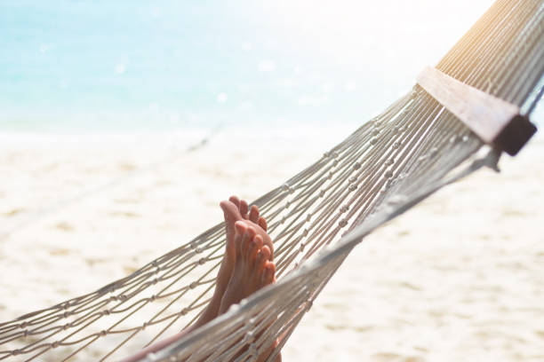 istock Low Section Of Woman In Hammock At Beach 1024950870