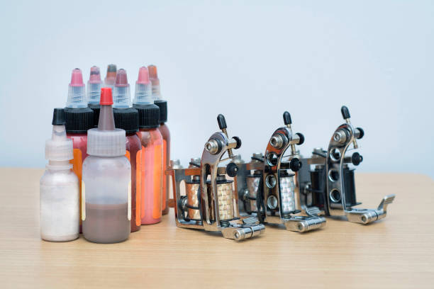 istock tattoo gun and ink 1024953004