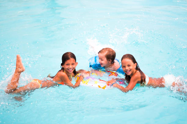 istock Children enjoying in the pool 1024954896