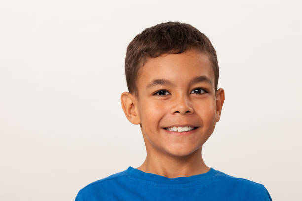 istock studio portrait of 10 year old schoolboy on white background 1024965064