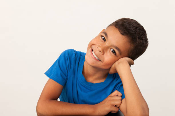 istock studio portrait of 10 year old schoolboy on white background 1024965904