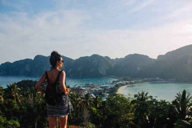 istock Young backpacker woman enjoys the beautiful view over Phi Phi islands in Thailand 1024966002