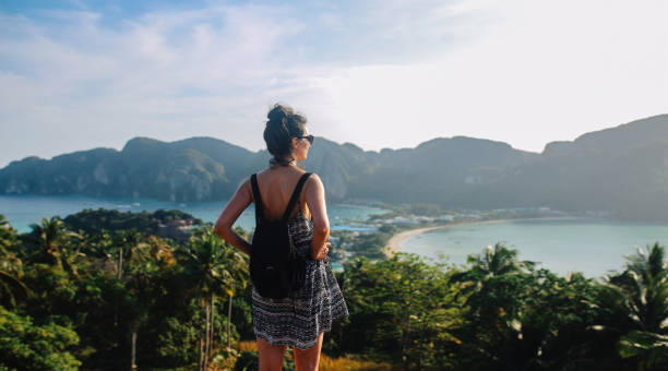istock Young backpacker woman enjoys the beautiful view over Phi Phi islands in Thailand 1024968744