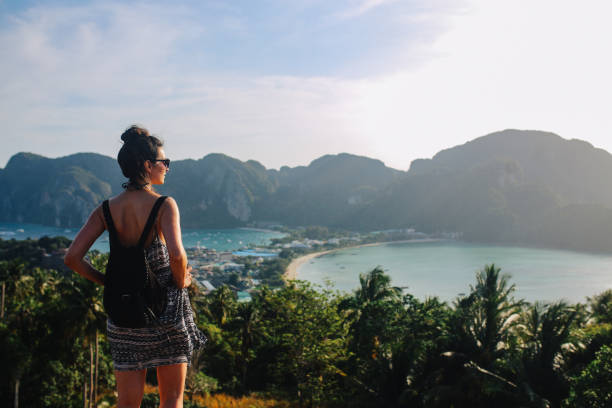 istock Young backpacker woman enjoys the beautiful view over Phi Phi islands in Thailand 1024968962