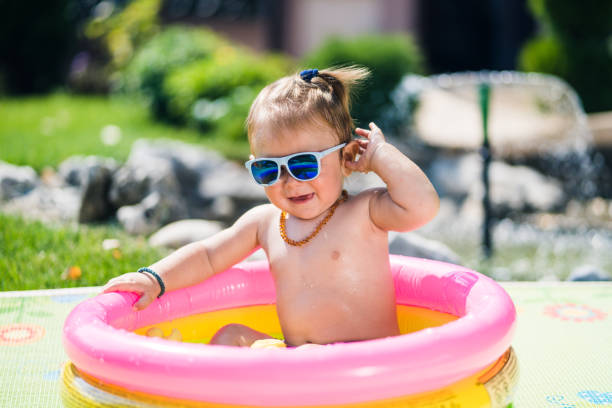 istock Cute toddler boy in inflatable pool 1024978922