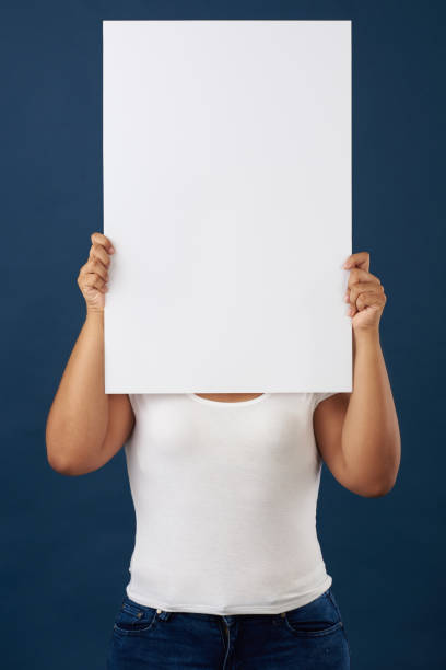 istock Woman hide face with white banner 1024981630