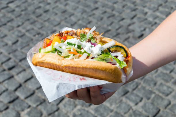 istock Kebab of Mustafa's Gemuese Kebab in a woman's hand. 1024996570
