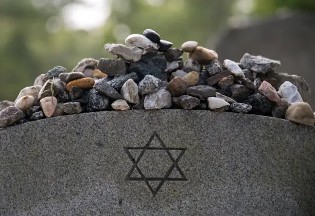 Remembrance stones left on a Jewish grave in Bonaventure Cemetery, Savannah Georgia.