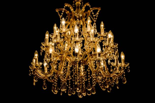 istock Luxury interior chandelier has light candles and dark background 1025001176