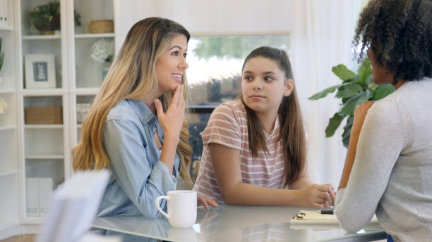 istock Mom and daughter attend therapy session 1025006158
