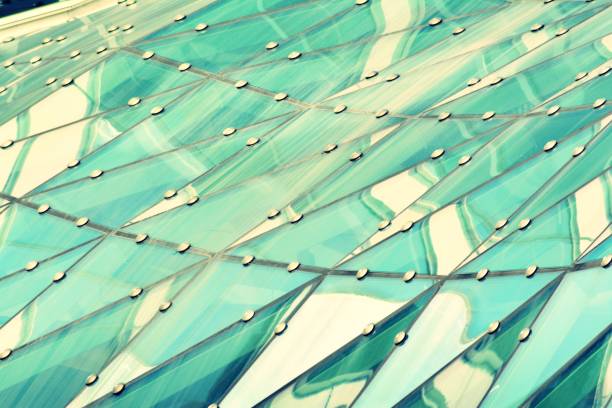 istock Modern office building on a clear sky background. Retro stylized colorful tonal filter effect 1025030538