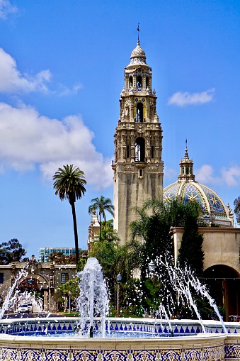 mosaic tile work on water fountain in front of ornate tower in San Diego, California