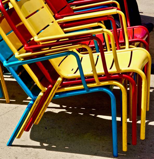 istock outdoor chairs stacked at day's end 1025033720