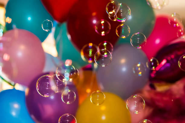 istock Soap bubbles against the background of inflatable balls 1025033794
