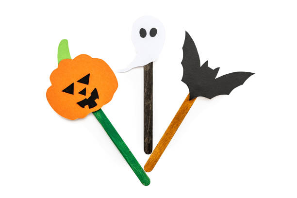 istock halloween hand made bookmarks wth a pumpkin, ghost and bat on a craft stick isolated on white with clipping path 1025034026