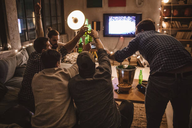 istock Friends spend weekend together watching TV 1025037562