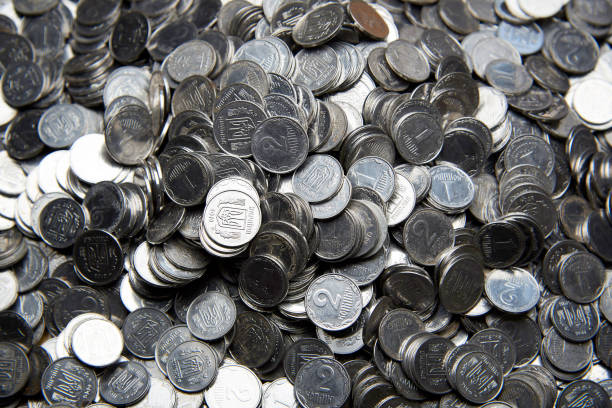 istock Background texture of old silver Ukrainian coins. 1025039466