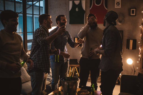 istock Friends watching game on TV 1025040584
