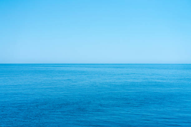istock Sea and the cloudless blue sky, flowing into the horizon. 1025044394