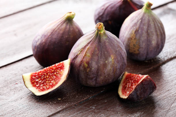 istock Fresh figs. Food Photo. whole and sliced figs on rustic background. 1025047726