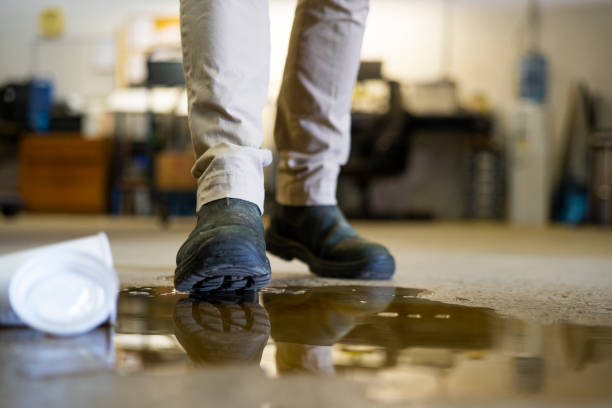 istock A worker in a warehouse walking in spilled liquid. 1025047764