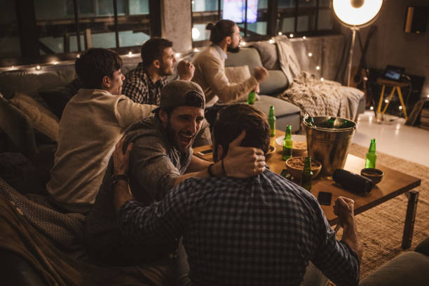 istock Friends spend weekend together watching TV 1025047816