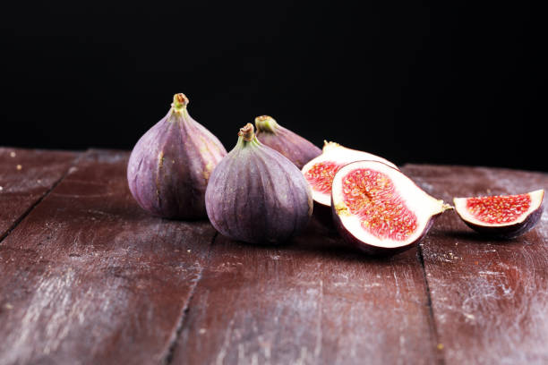 istock Fresh figs. Food Photo. whole and sliced figs on rustic background. 1025047842