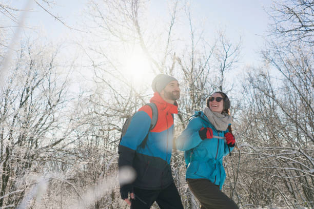 istock Happy couple hiking in the forest 1025047892