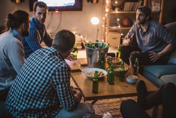 istock Friends watching game on TV 1025047980