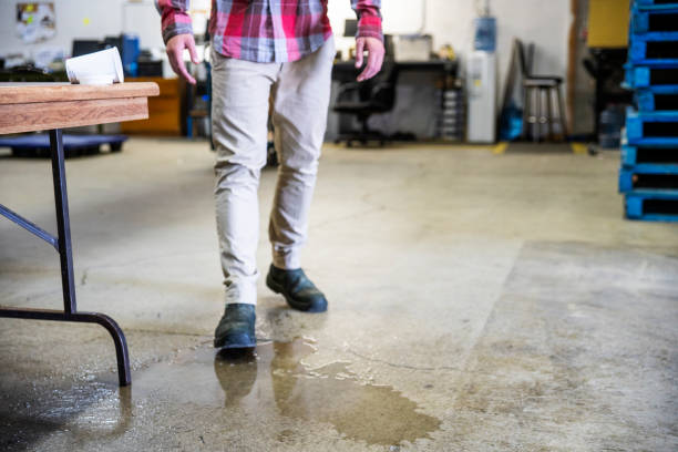 istock A worker in a warehouse walking in spilled liquid. 1025052684