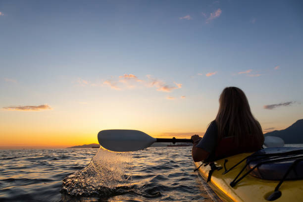 istock Girl Sea Kayaking during Sunset 1025055104