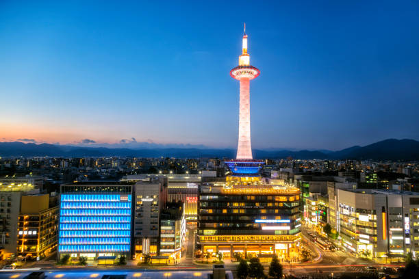 The Kyoto Tower at dusk. Kyoto tower has two distinct structures: tower with observation deck and tower hotel with 160 rooms, Japan.
