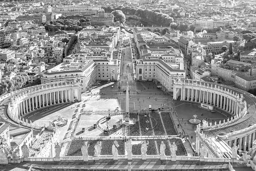 View of St. Peter Square and Rome skyline from the Dome of St. Peter Basilica in Vatican, Italy