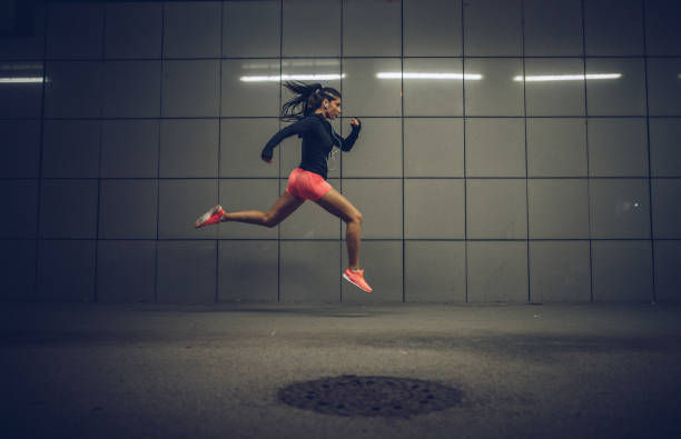 istock Woman run and jump 1025070776
