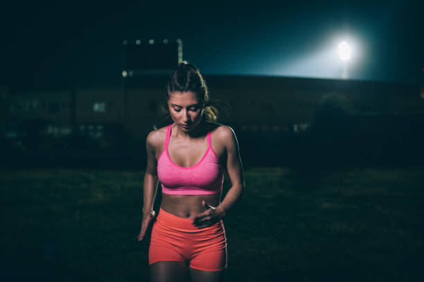 istock Woman training in the dark 1025076384