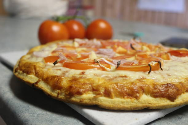 istock vegetarian pizza with onion, tomato and garlic on it 1025076470