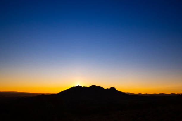 istock Australian Outback sunset on silhouetted mountain 1025076586