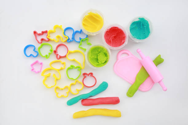 istock Colorful dough and rolling pin on white background for kid play to develop EQ and IQ. 1025082198