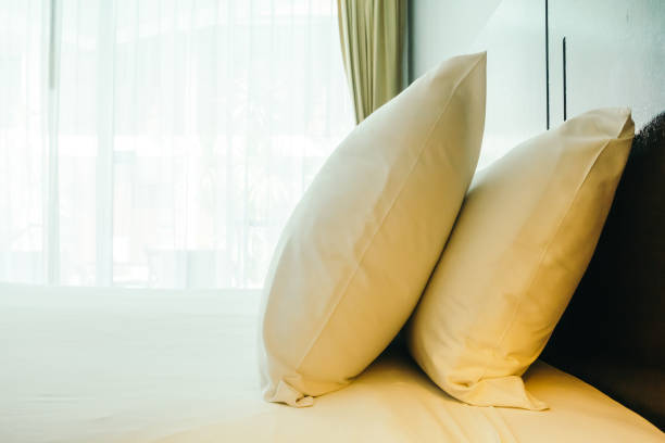 istock Close-Up Of Pillows On Bed 1025091494