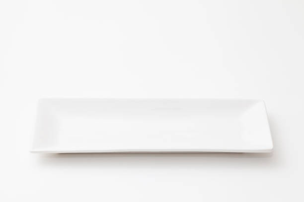 istock Slender and white pottery dish on white background 1025118526
