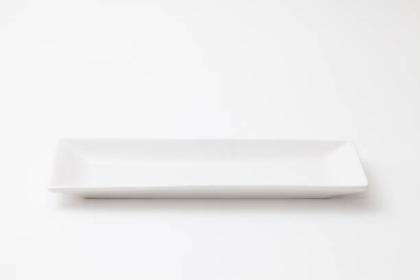 istock Slender and white pottery dish on white background 1025118534