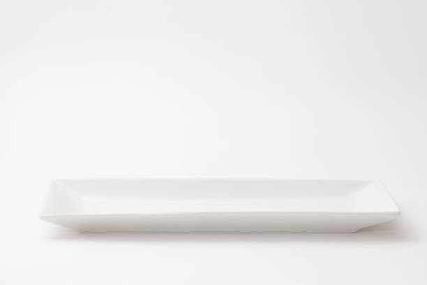 istock Slender and white pottery dish on white background 1025118566