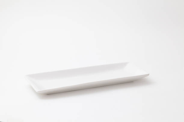 istock Slender and white pottery dish on white background 1025118686