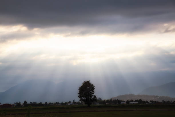 Striking view of the country side during a dramatic sunset. Taken in Chilliwack, East of Vancouver, BC, Canada.